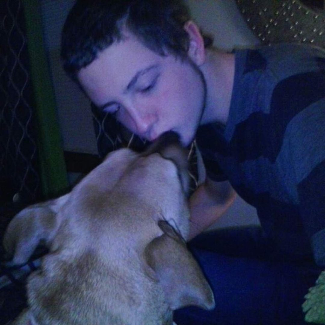 Zachary my son kissing his dog Angel