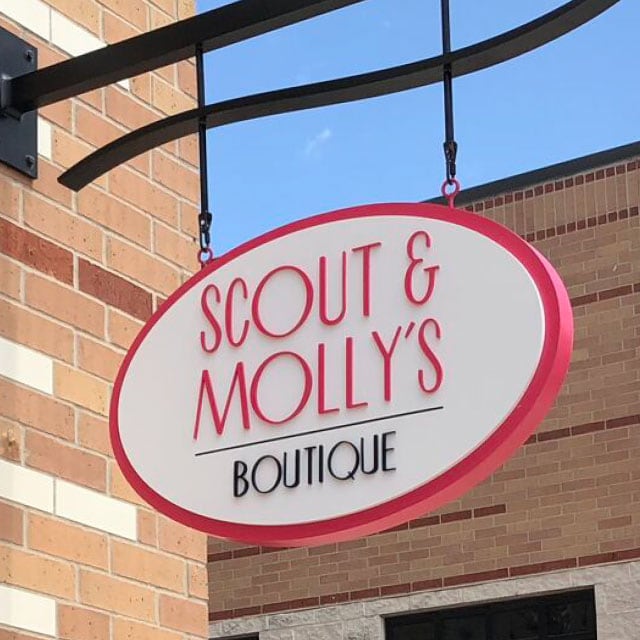 Scout & Molly's sign hanging in front of store