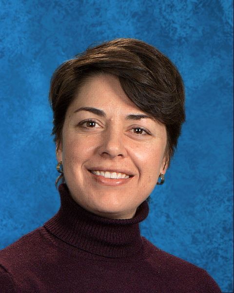 School principal looking into the camera. 