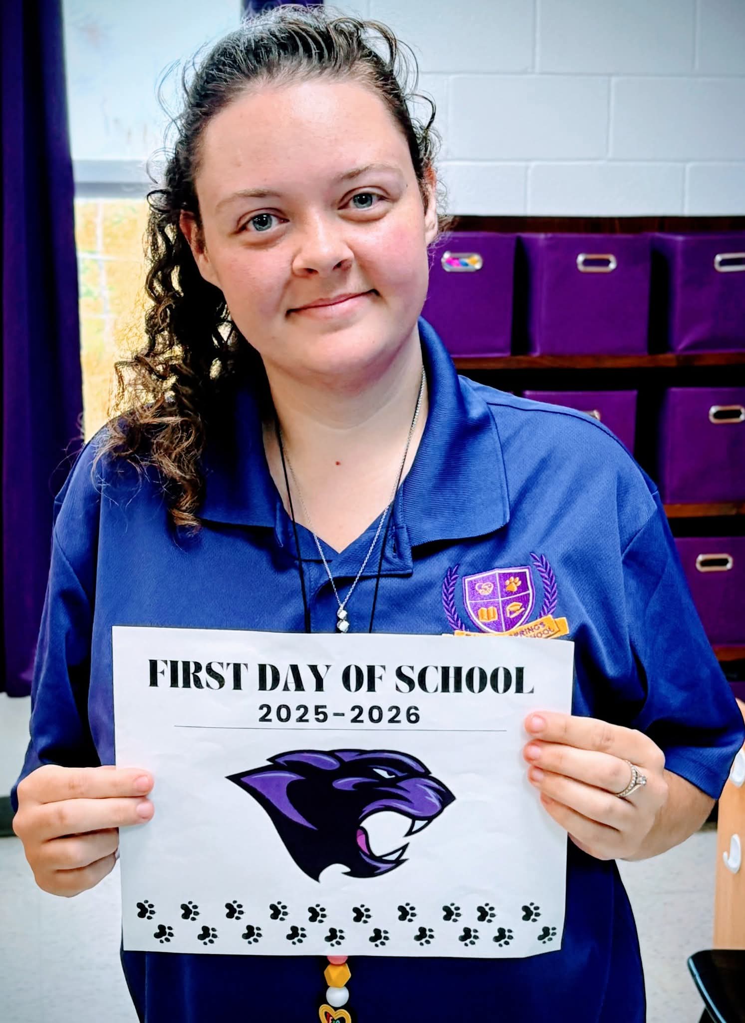 CTrimble holding a sign