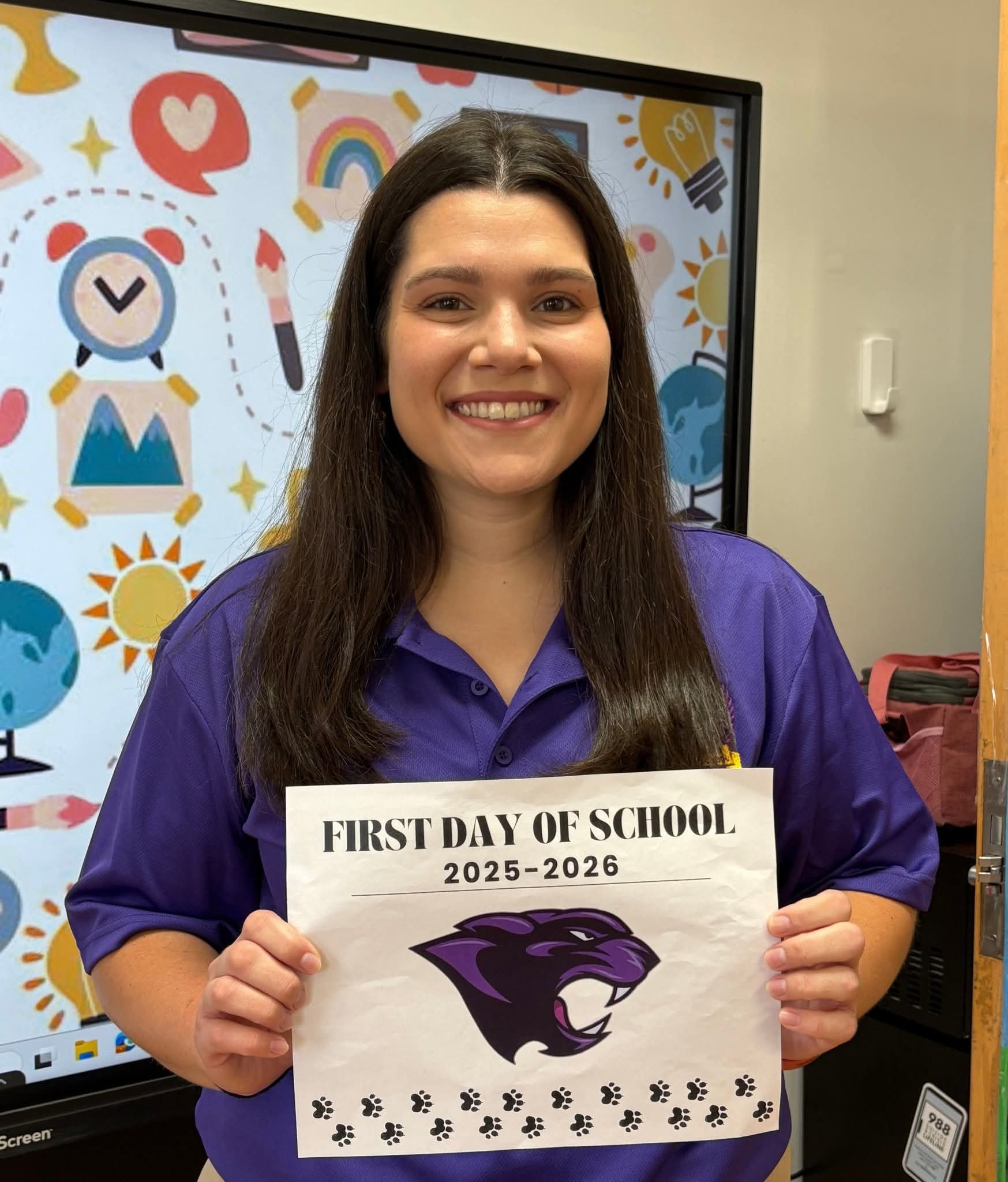 E.Woolsey holding a sign
