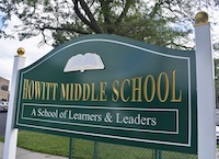 A green sign reads 'Howitt Middle School' with the tagline 'A School of Learners & Leaders'.