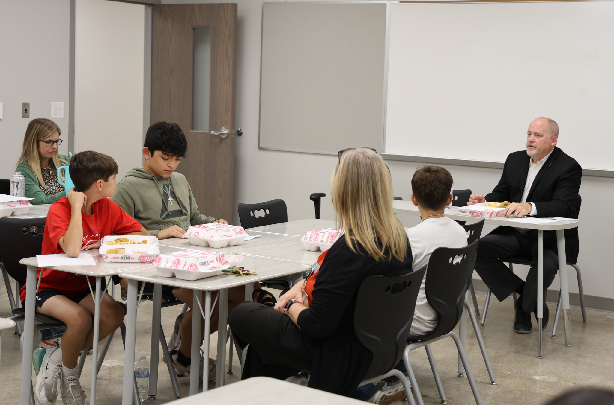 superintendent and students in classroom setting