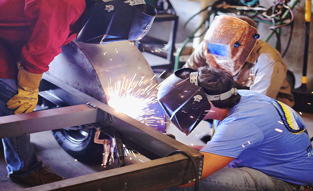 image of students welding