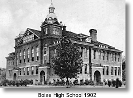 A historic brick building, Boise High School, is shown in a black and white photograph.
