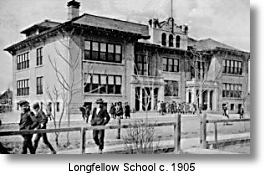 Black and white photo of Longfellow School, circa 1905, with people in front.