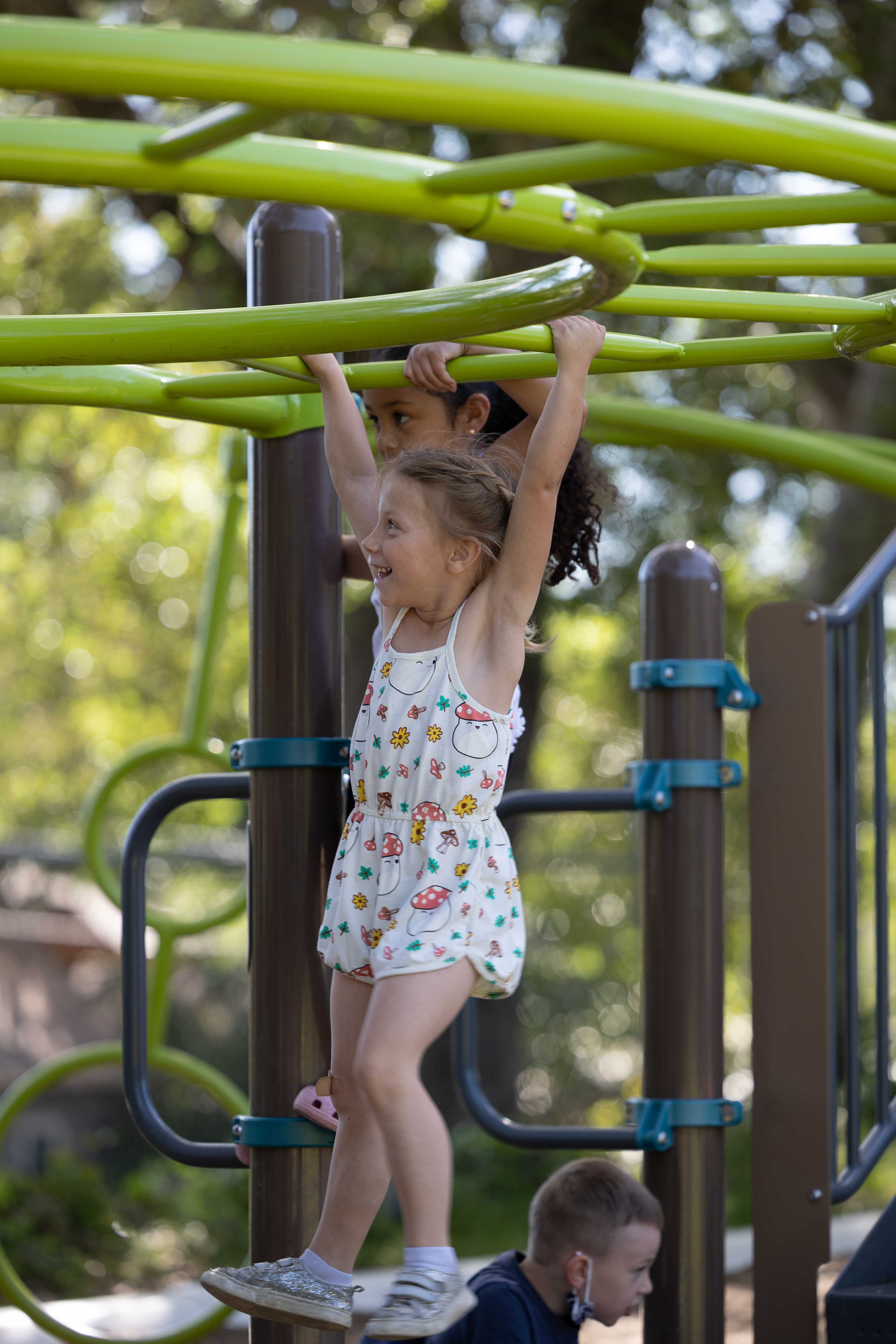 Child on monkey bars
