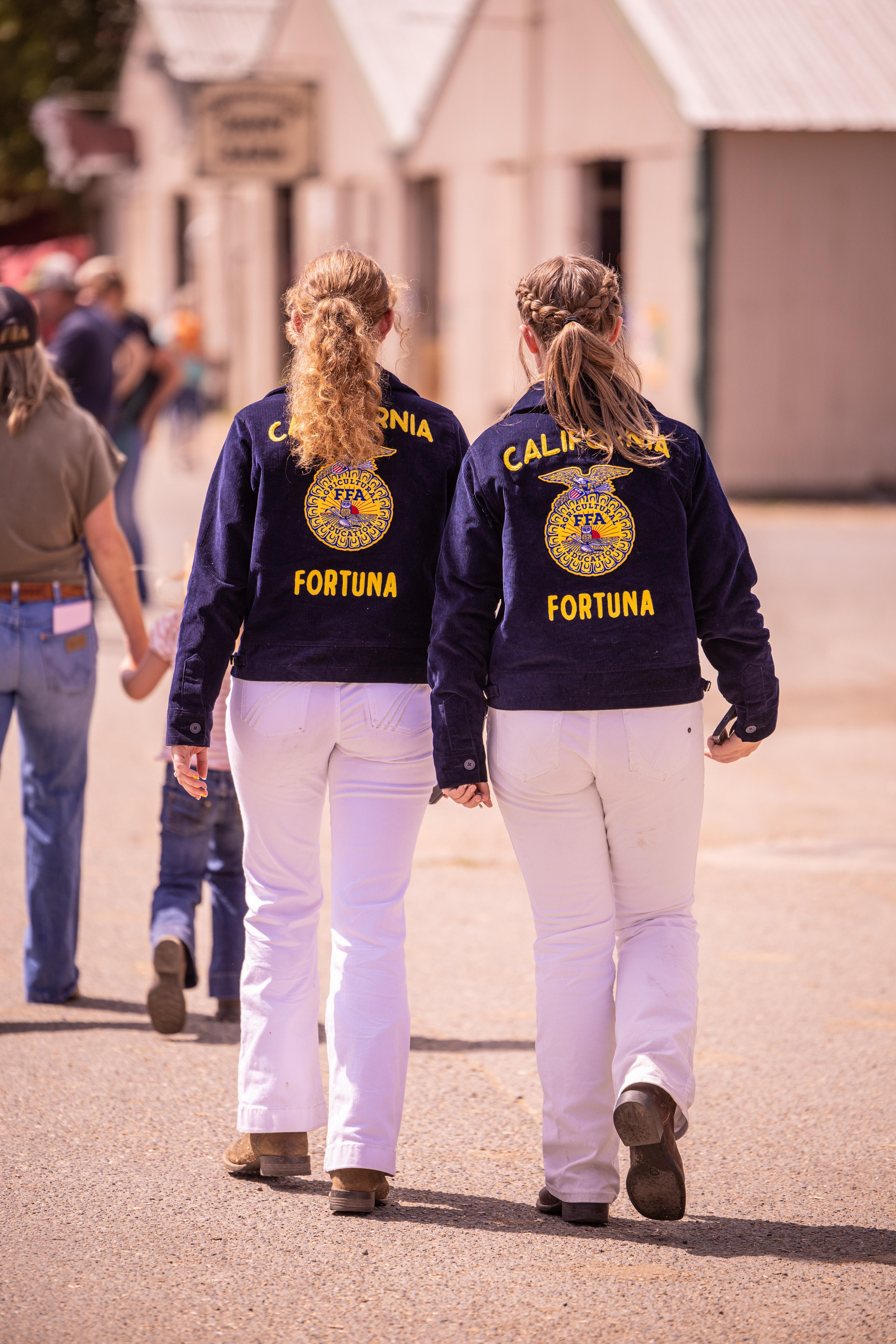 Two girls walking at the Fair
