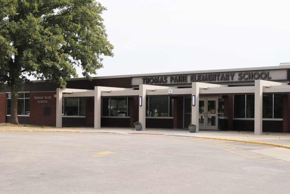 The entrance to Thomas Park Elementary School, with a sign above the doors.