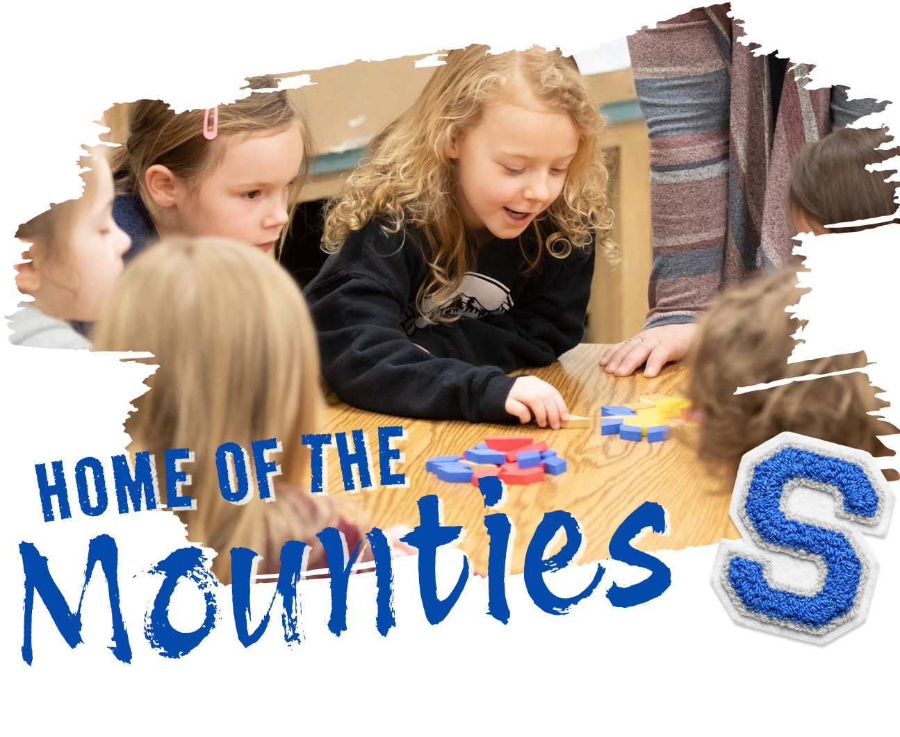 Children gather around a table, engaged in a game or activity.
