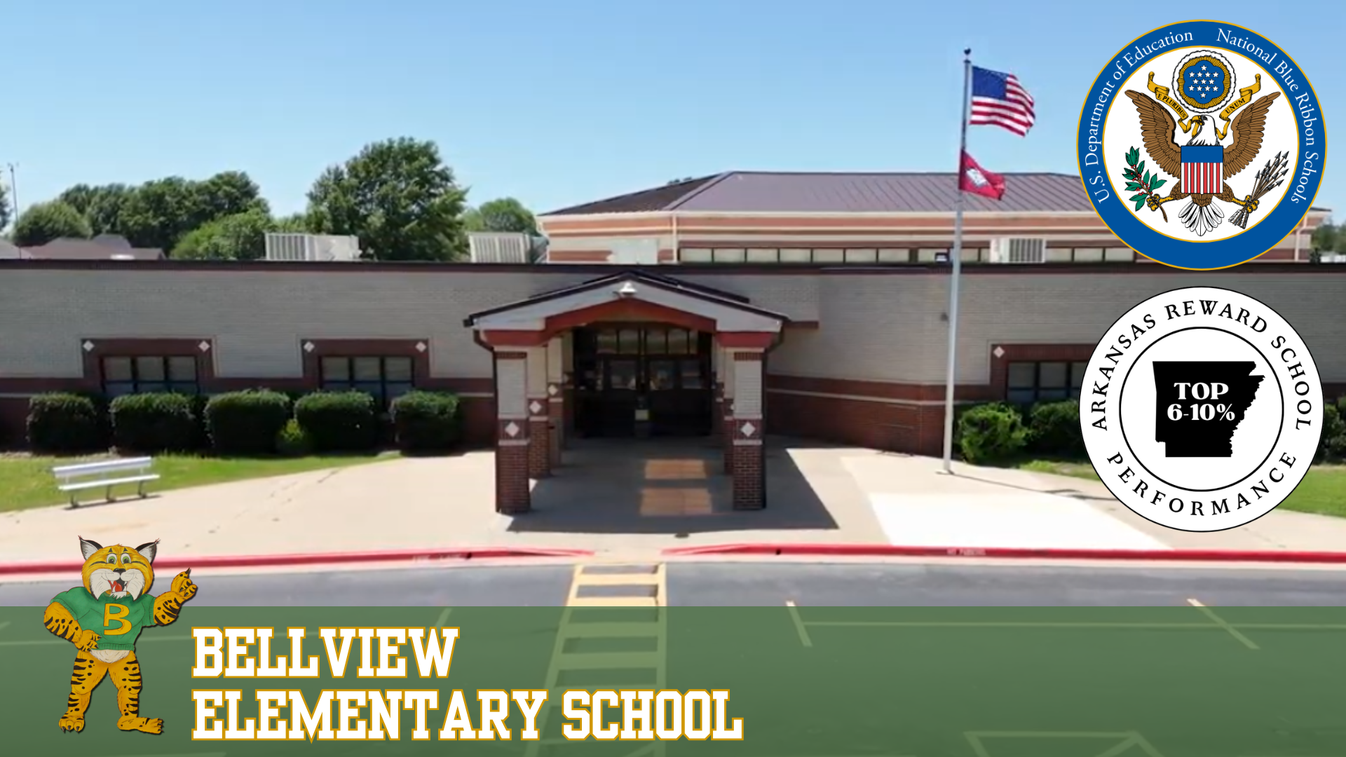 Bellview Elementary School building exterior with a mascot and official seals.