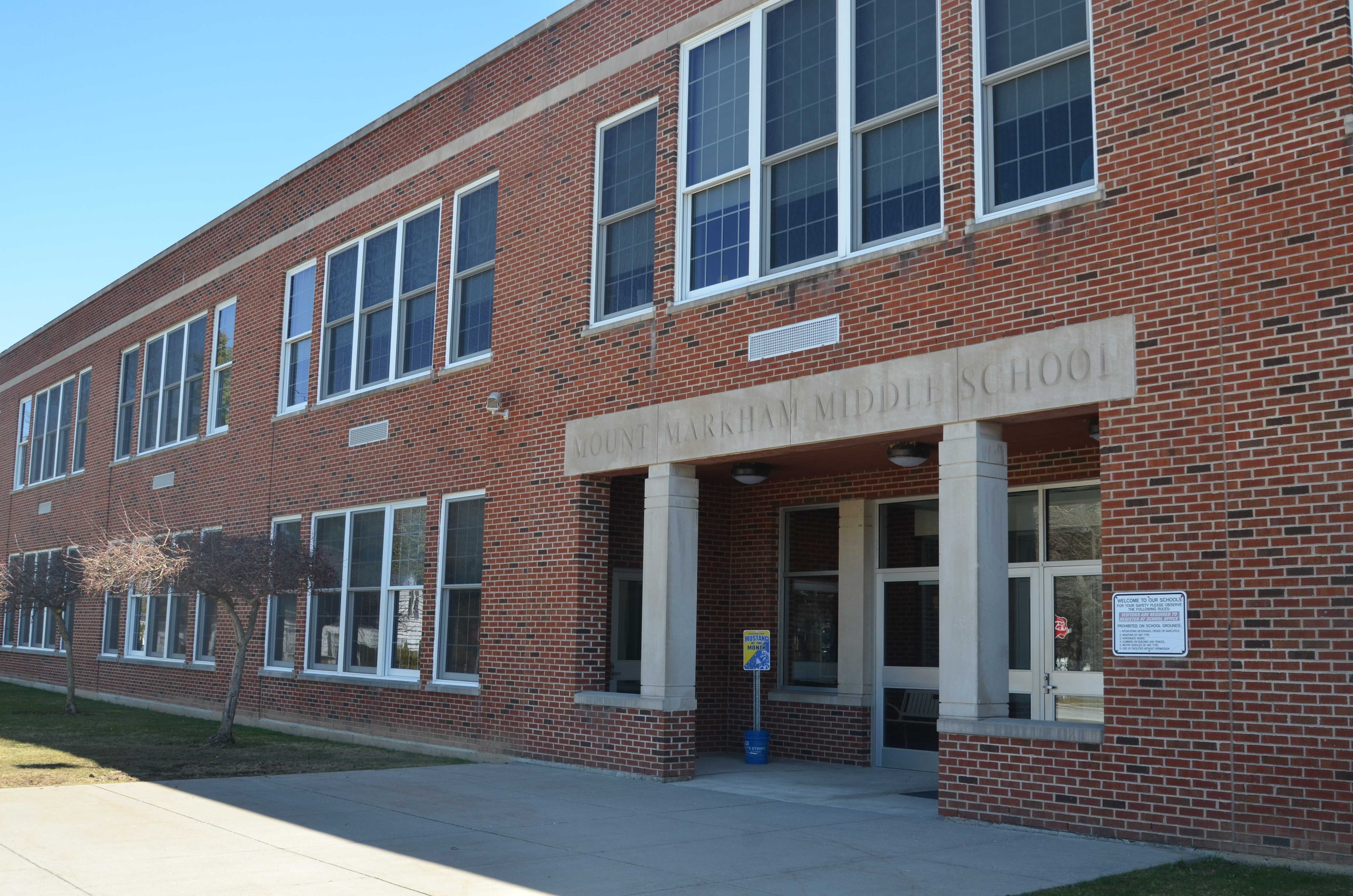 The exterior of Mount Markham Middle School, a brick building with many windows.
