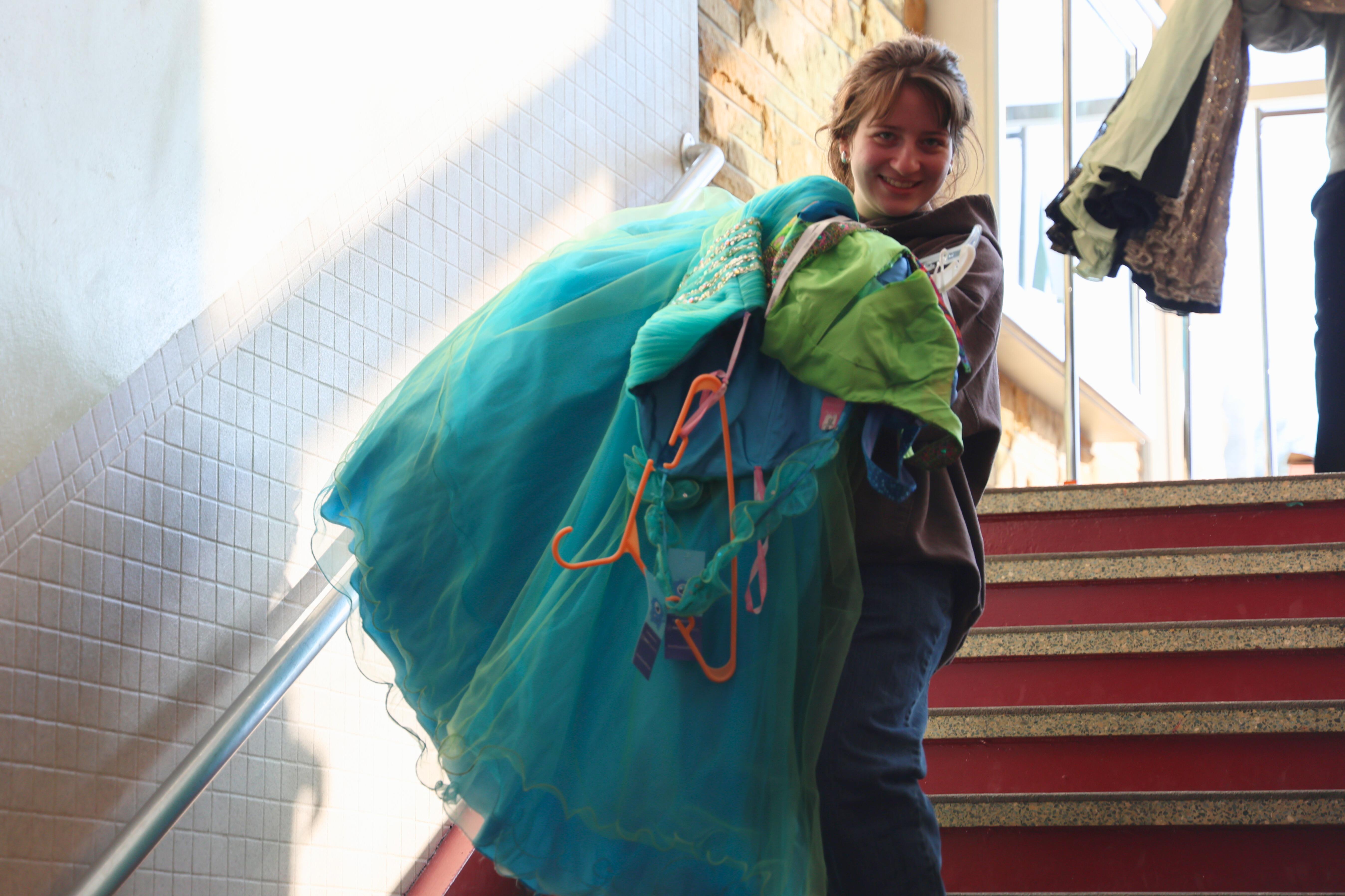 Student carries dresses down CCHS stairs