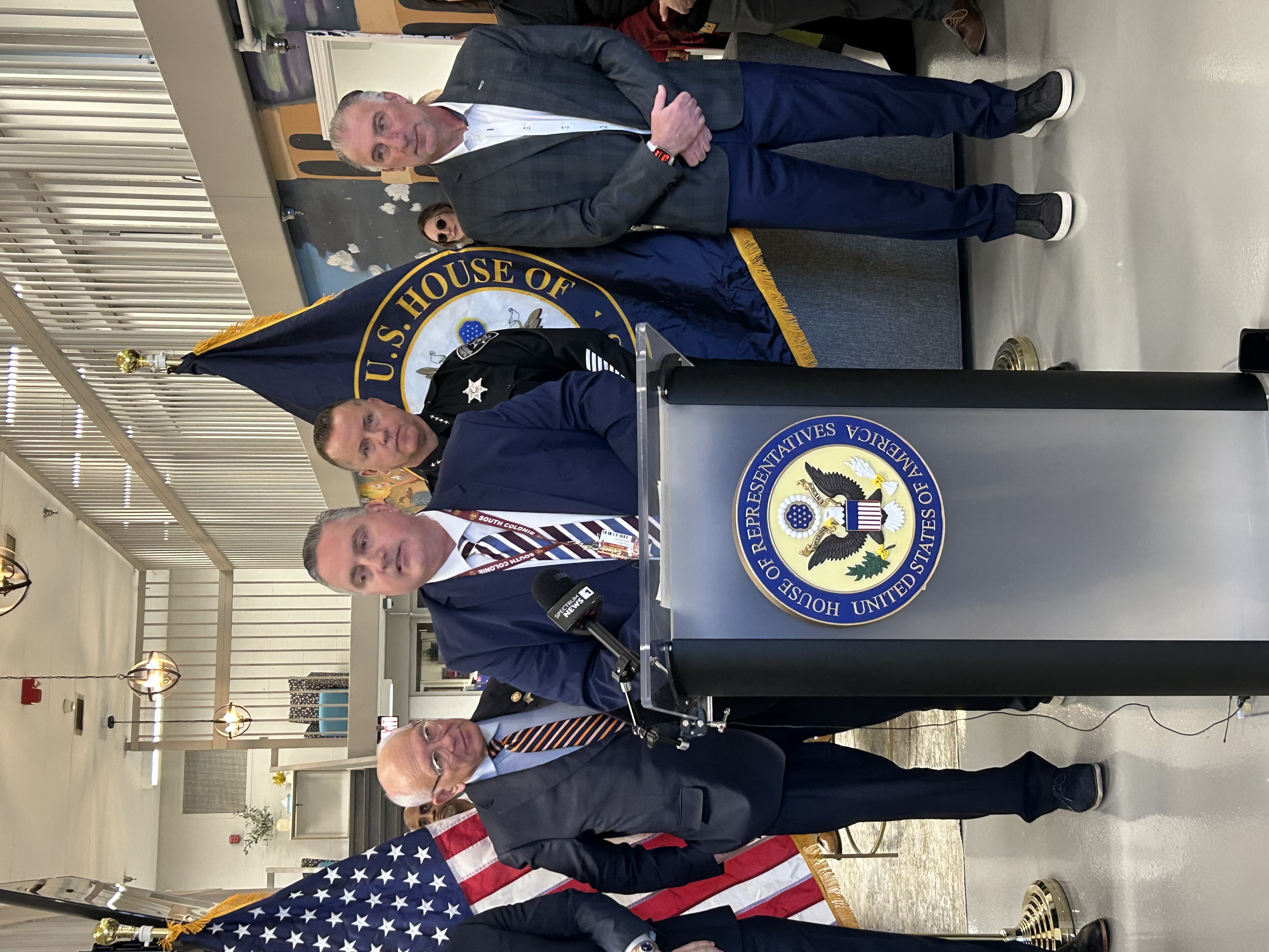 Dr. Perry stands at the podium at the press conference on Friday, Jan. 10