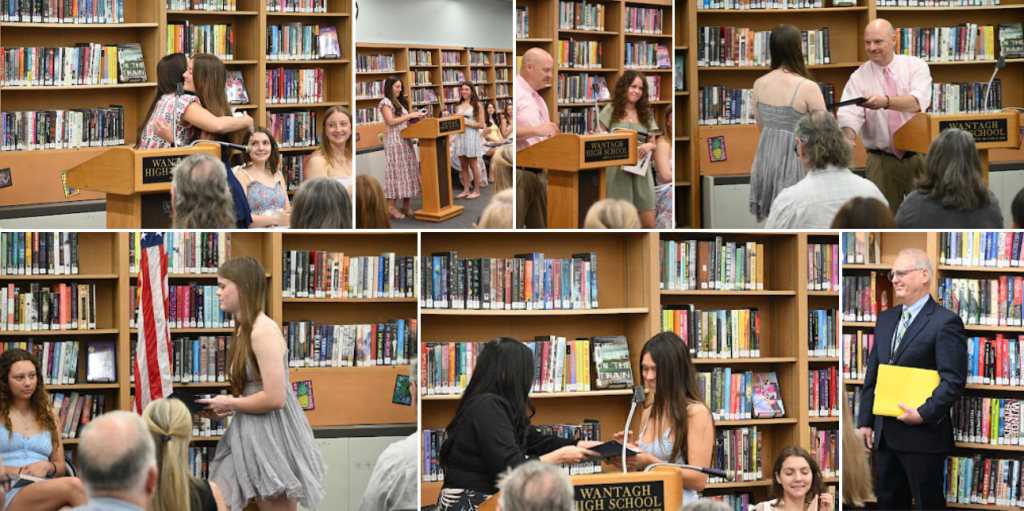 A group of people, likely students and adults, are gathered in a library with bookshelves in the background.
