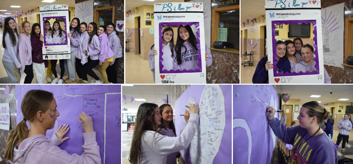 Students pose for photos with a framed sign in a school hallway.