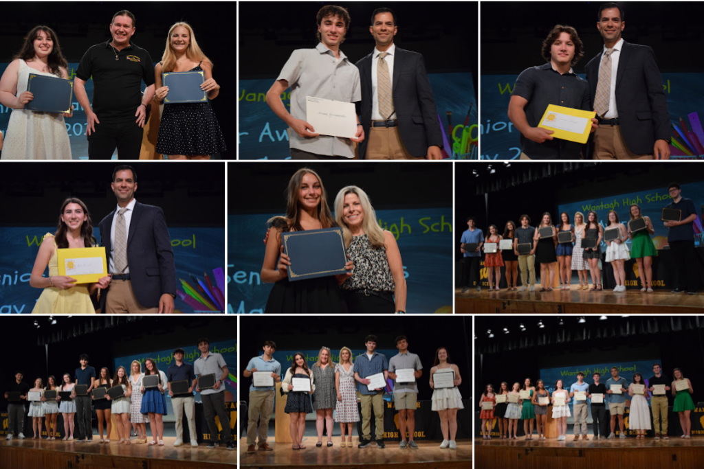 A group of students and adults stand on a stage, receiving awards.