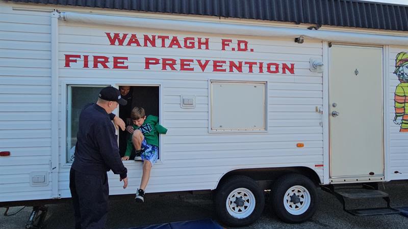 student participating in fire safety lesson