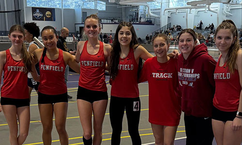 Members of the indoor track team at a meet.