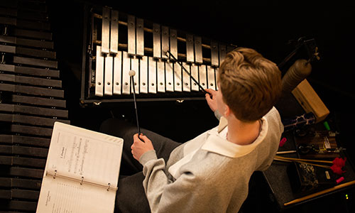 A student musician performs.