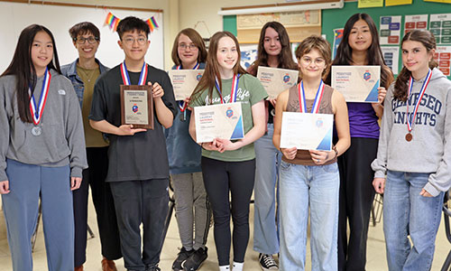 Students in Julie Wilken's French 2 class with their medals and certificates.