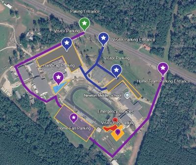 Aerial view of a school campus with marked walking routes and pins.