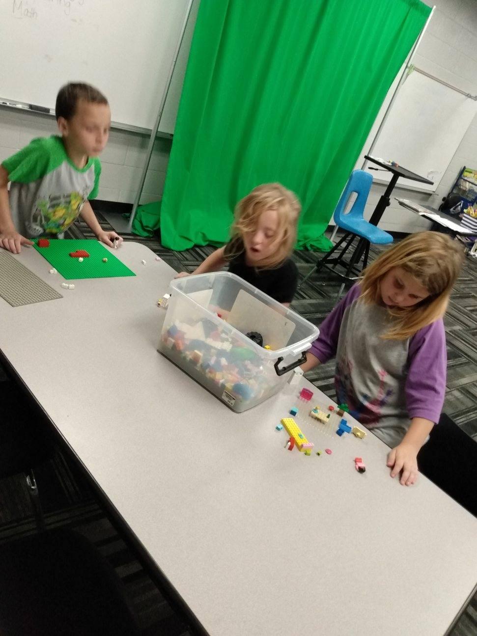 Children playing with Legos together