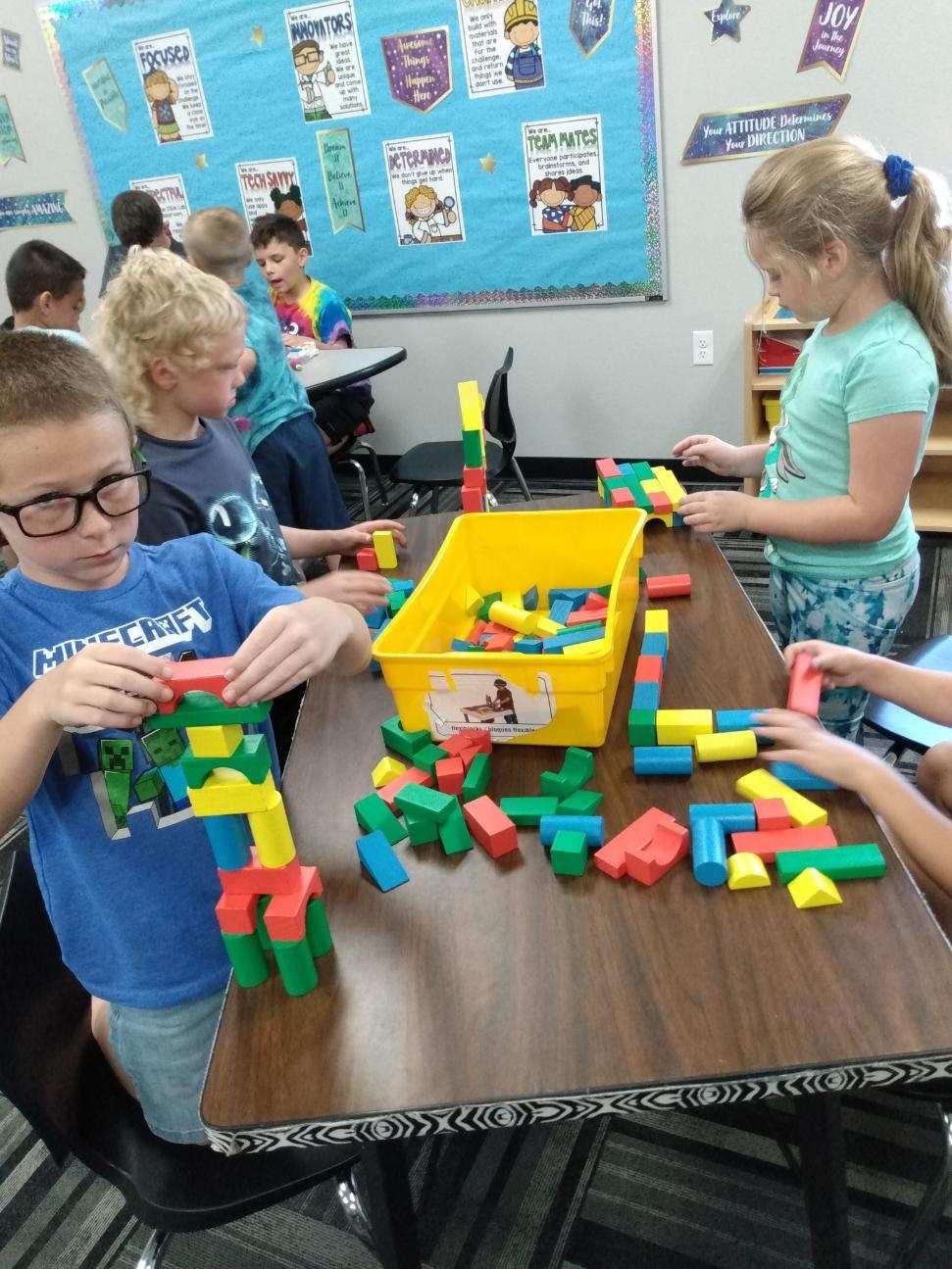 Children playing with building blocks together