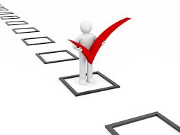 Figure holding a red checkmark on a row of checkboxes