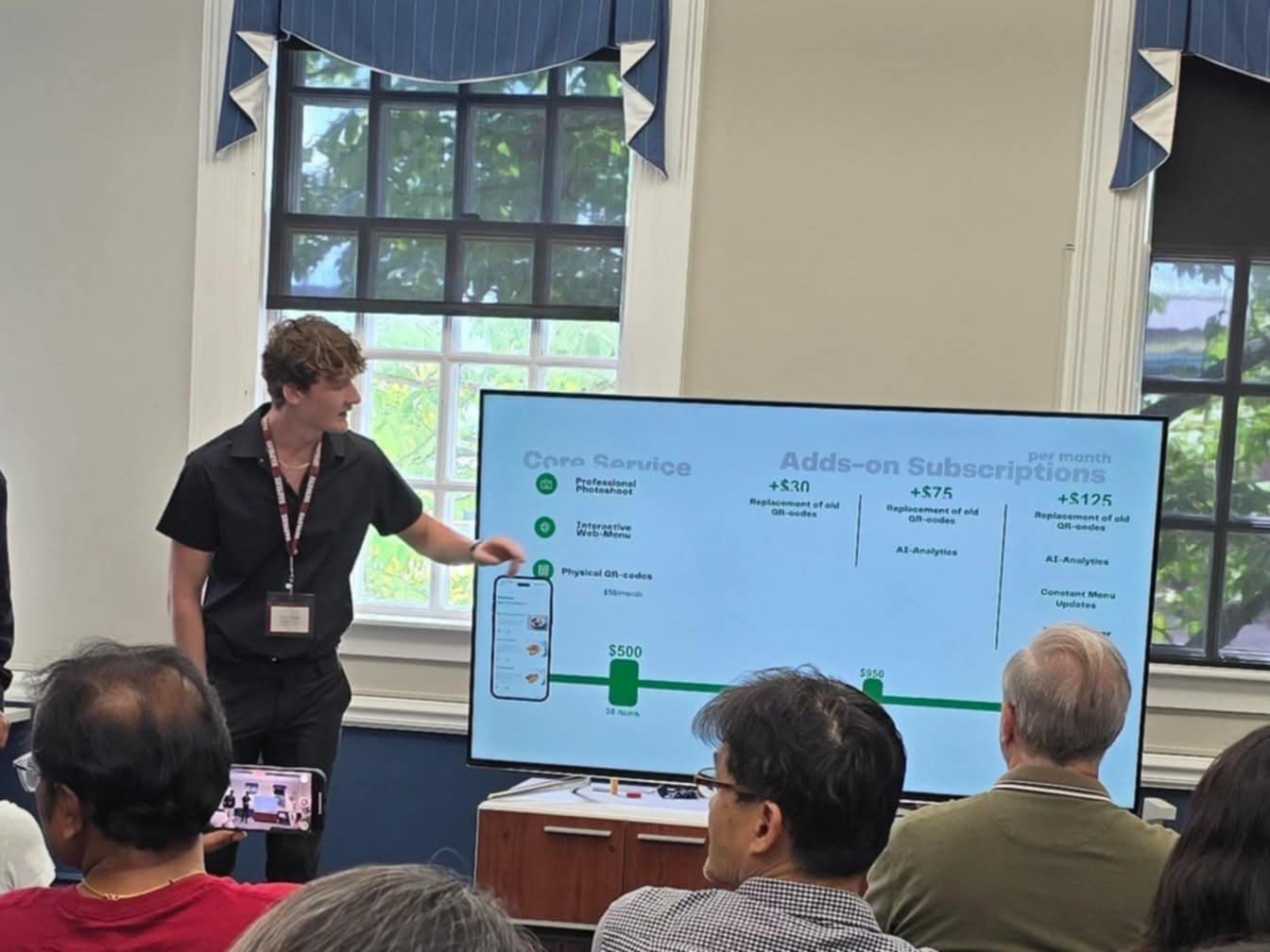 MHS senior makes a presentation at a Harvard summer camp in 2025.