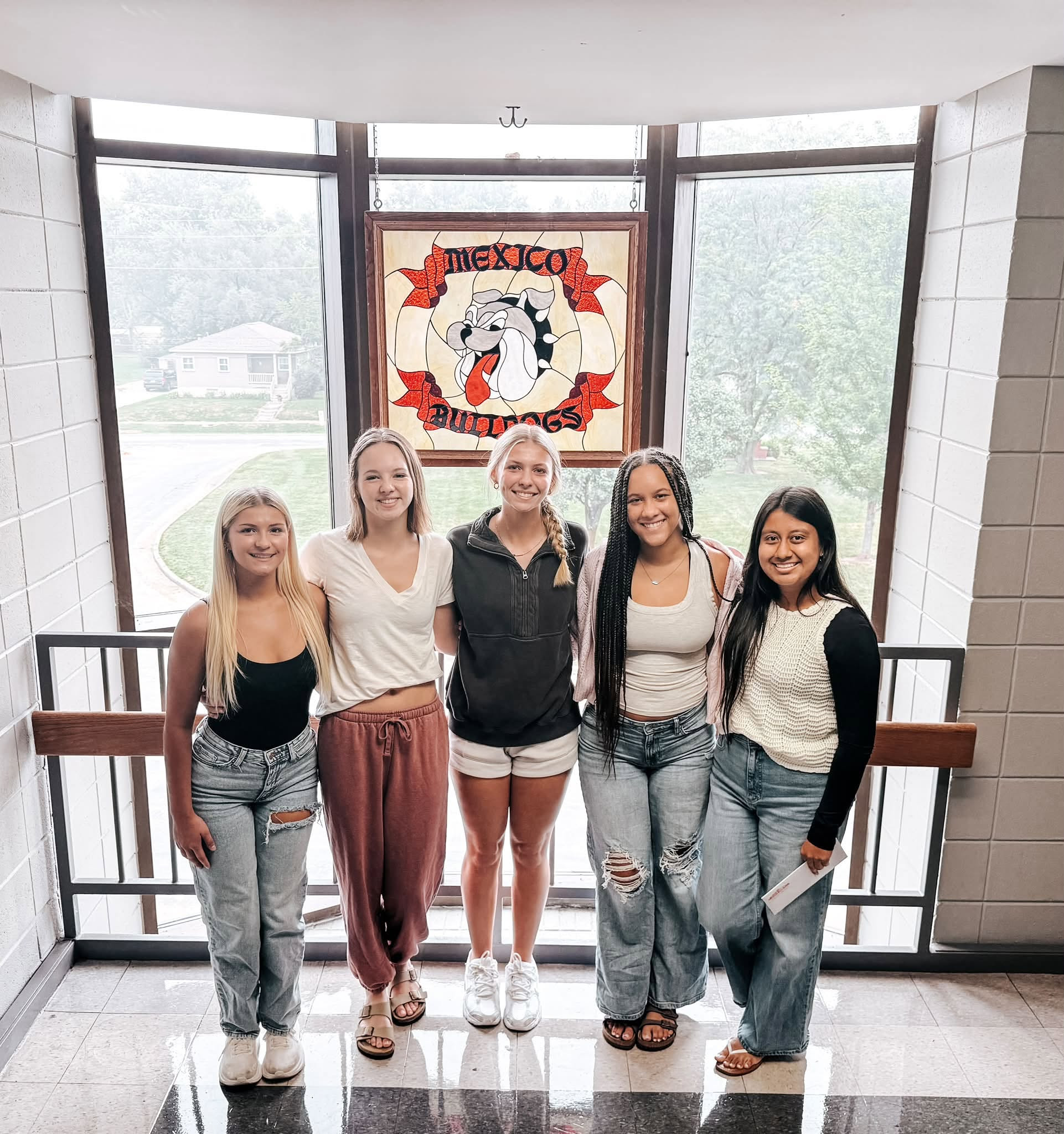 five homecoming queen candidates posing for a photo