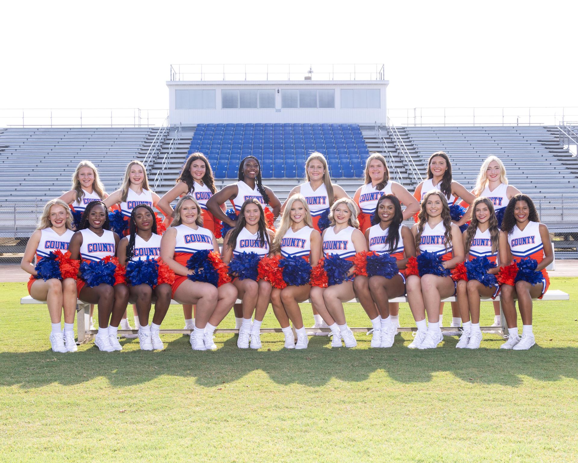 cheerleaders sitting on the bench