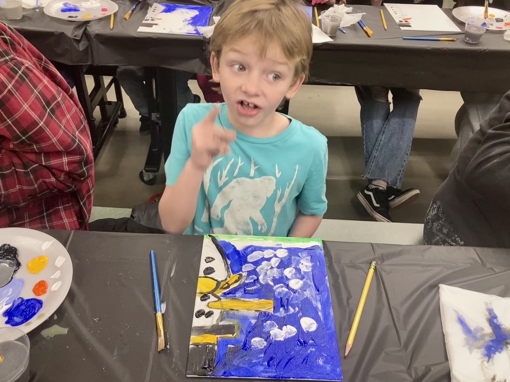 a boy painted an art on canvas