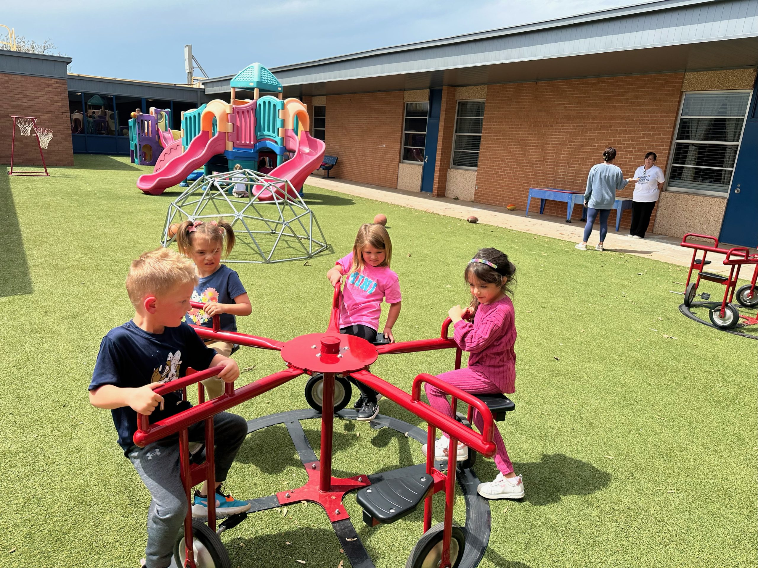 A group of children are playing on a playground.