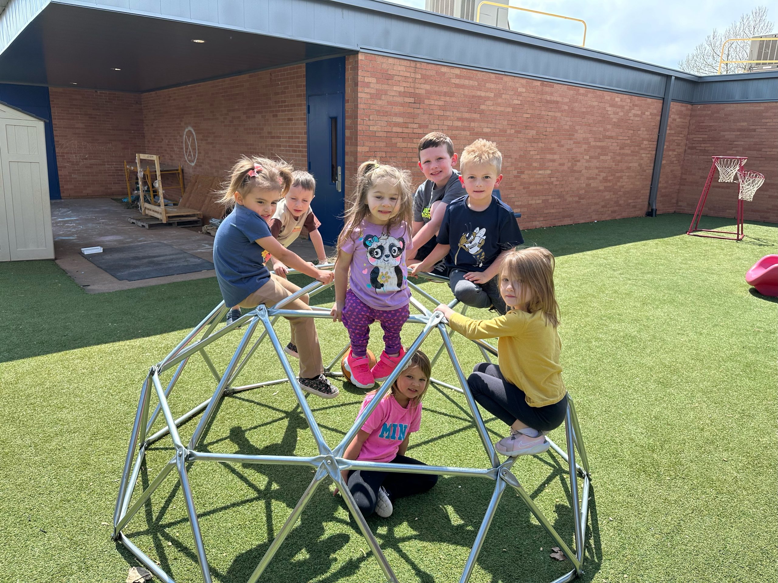 A group of children are playing on a playground.