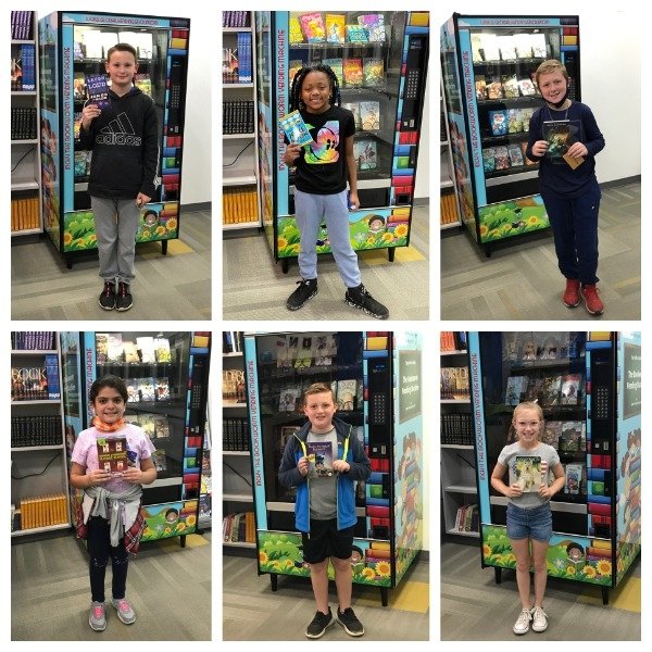 A group of children are standing in front of a vending machine.