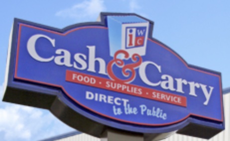 A blue and white sign with the words 'Cash & Carry' in white lettering, with the tagline 'Food - Supplies - Service Direct to the Public'.