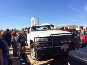 Students looking at Alex's truck after the program.