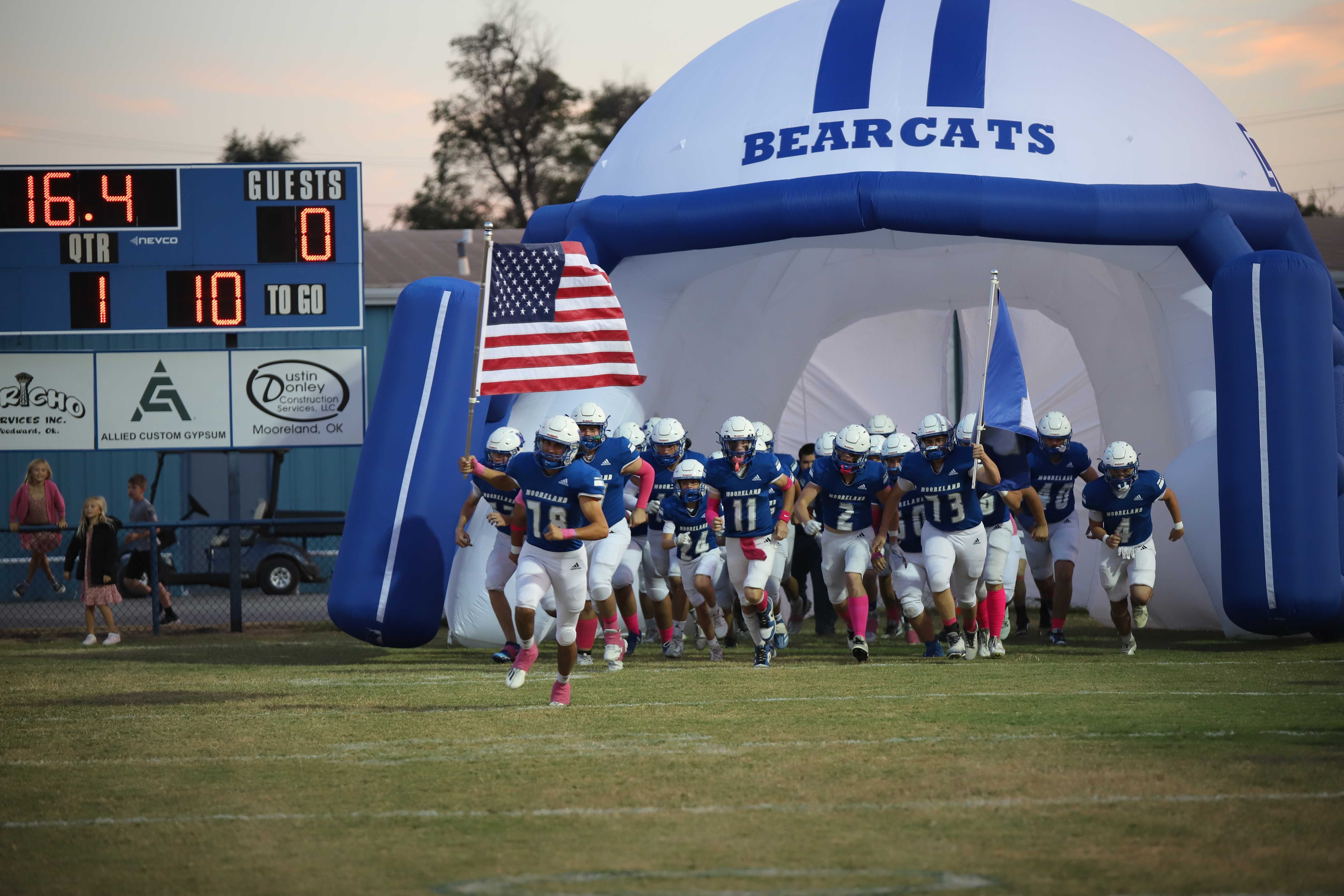 Bearcats charge the tunnel before a home football game.
