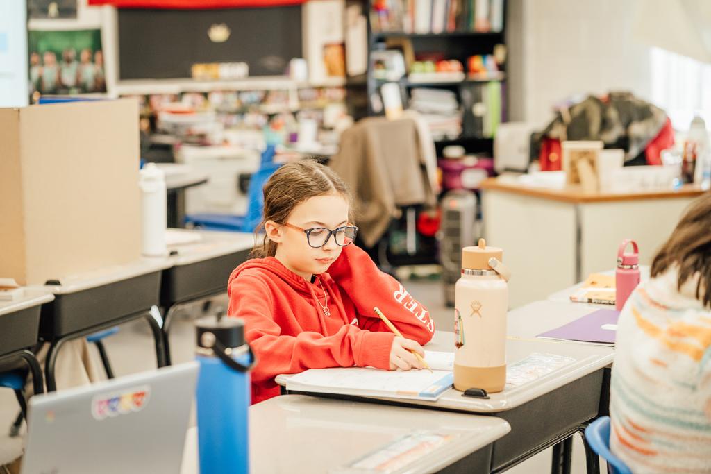 Muraco student works at a desk