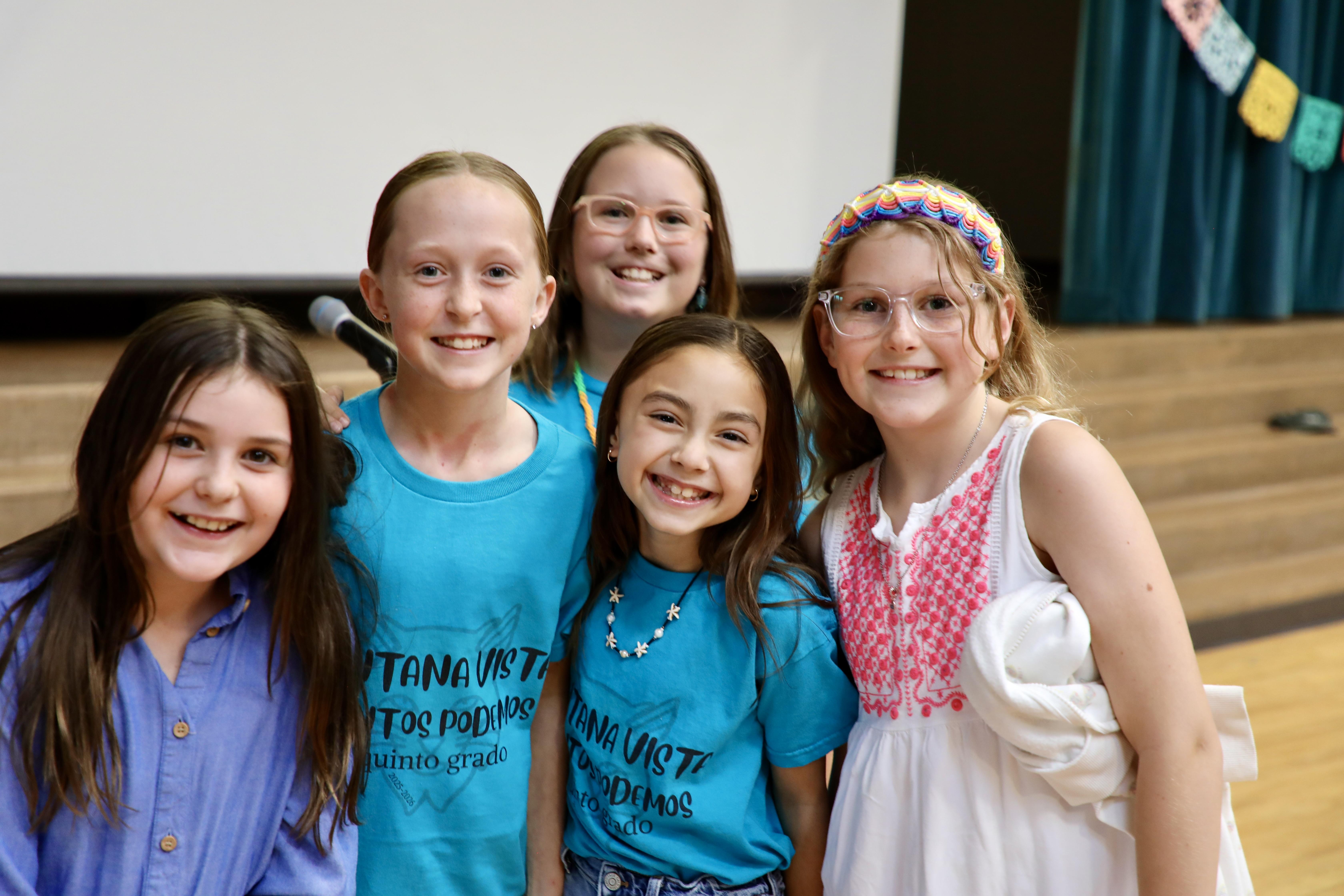 Group of students at a microphone