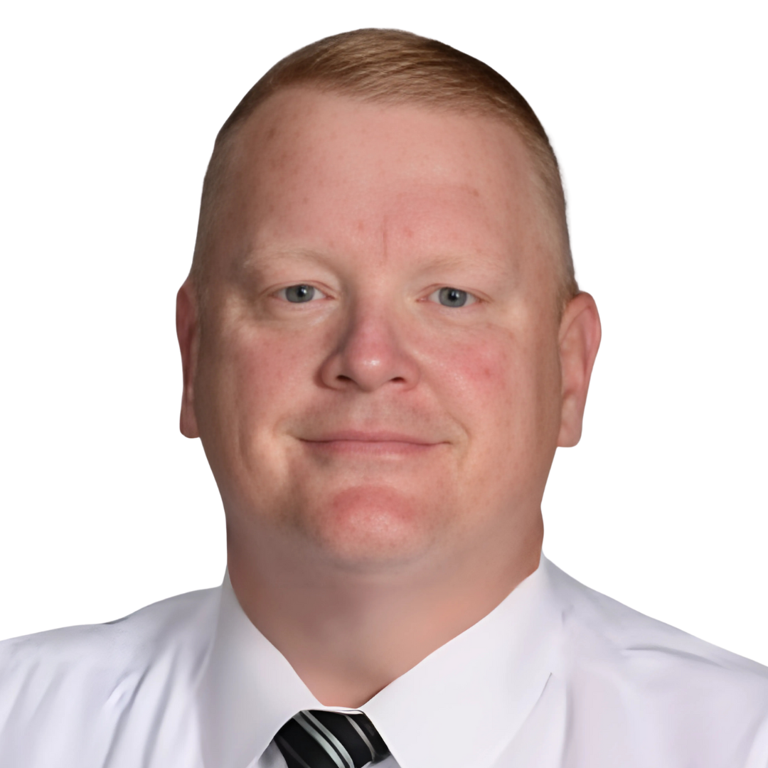 Chad Carter, A headshot of a man with short blonde hair, blue eyes, and a light complexion, wearing a white collared shirt and a striped tie.