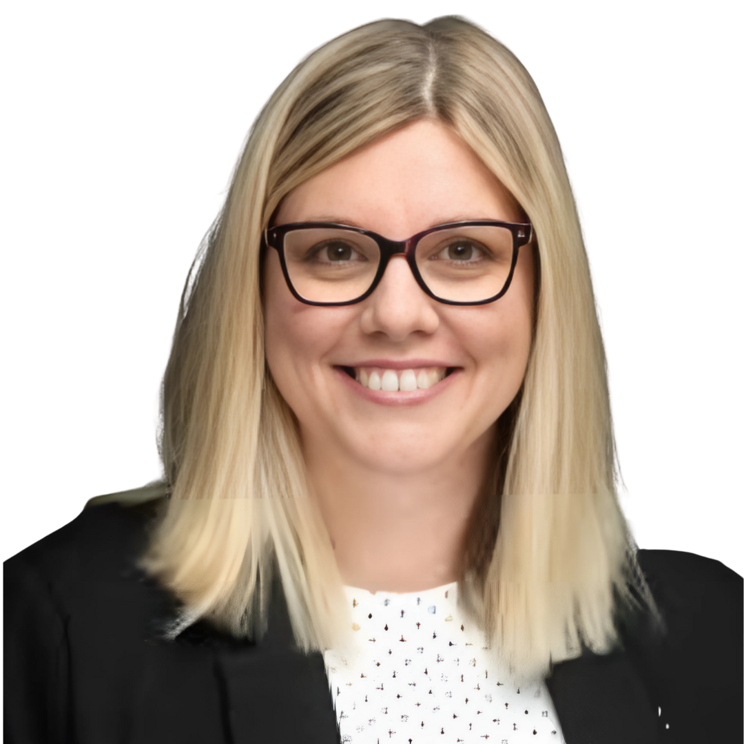 A woman with blonde hair and glasses smiles at the camera.