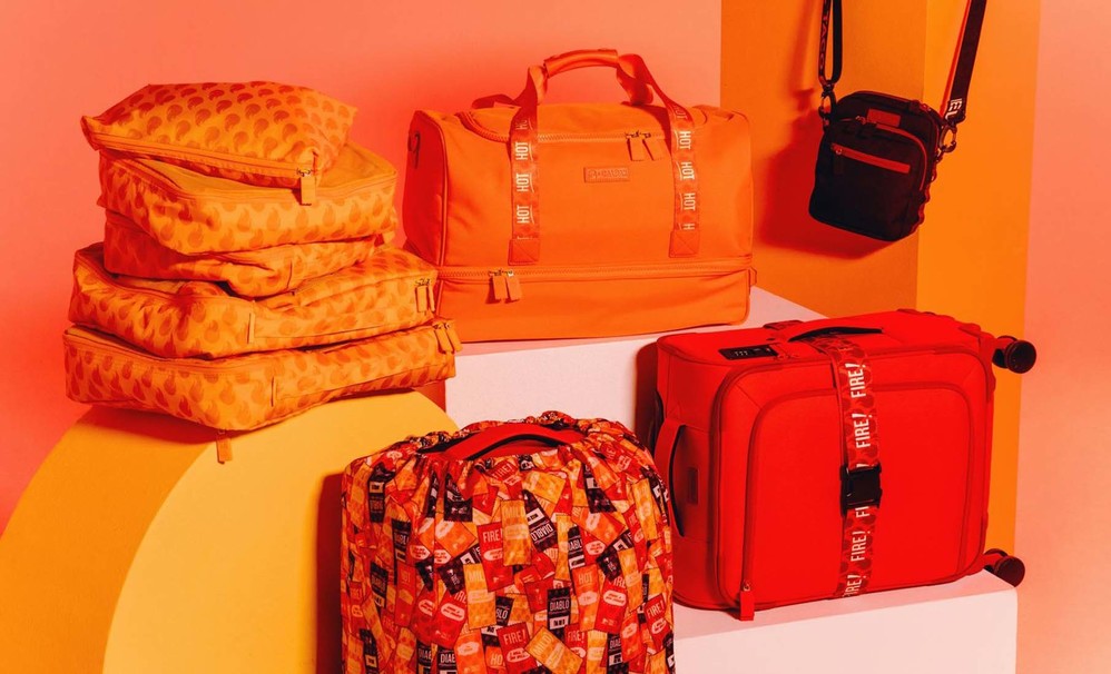 Taco Bell x CALPAK Drops Hot SauceInspired Luggage