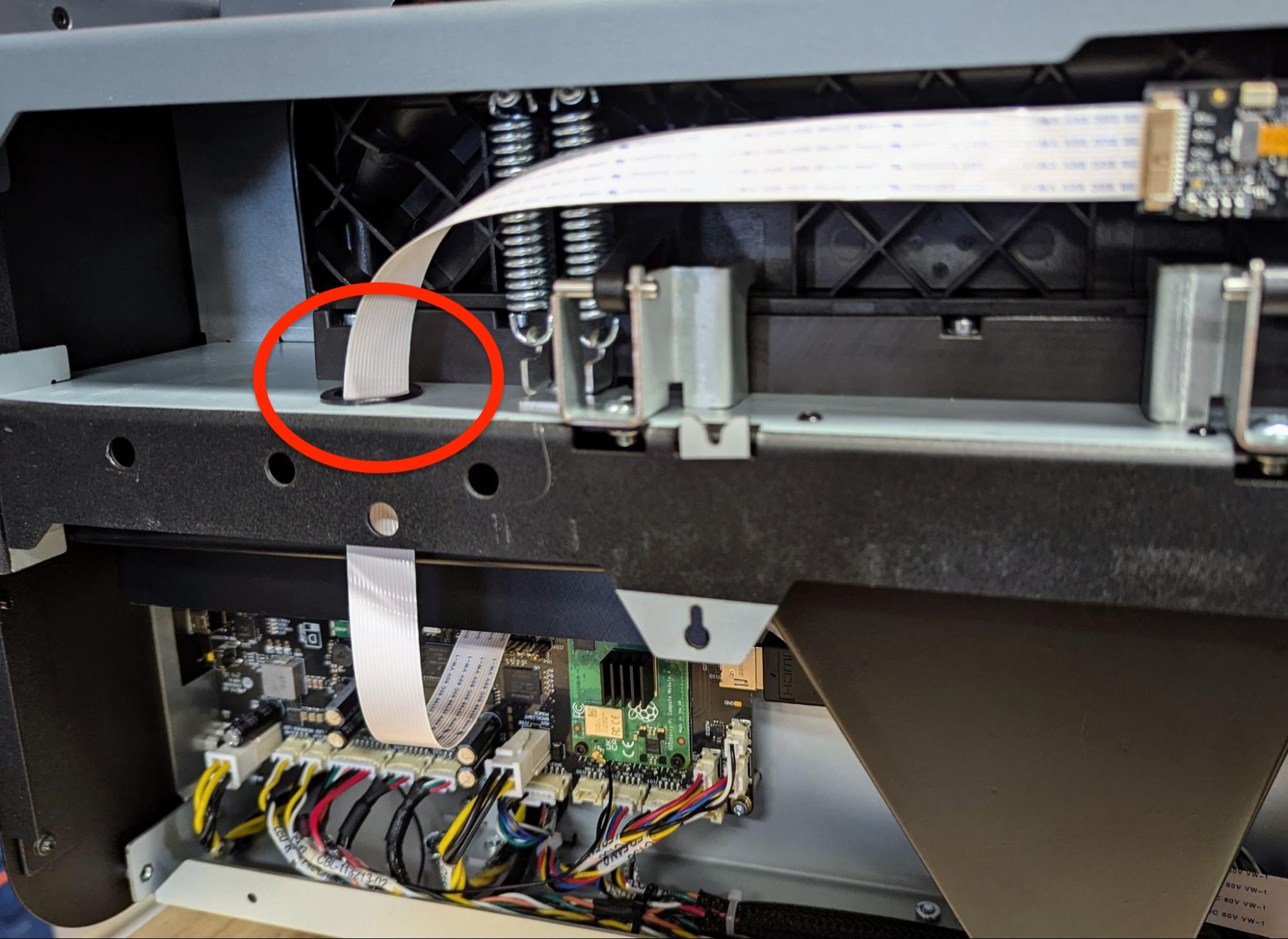Thread the camera board ribbon cable