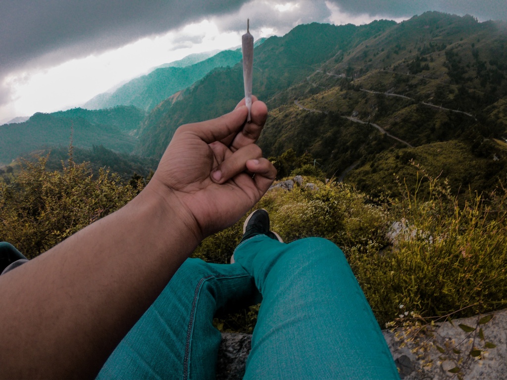 Low Section Of Person Holding Hands Against Mountains GreenState 