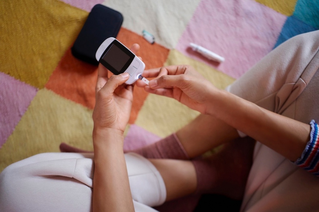 Cannabis diabetes research: photo of person conducting at-home glucose test.