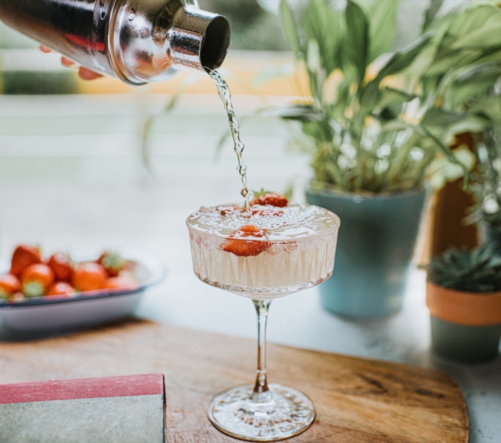 GETTY Cannabis mocktails: Cocktail being poured from a metal cocktail shaker into a stylish glass
