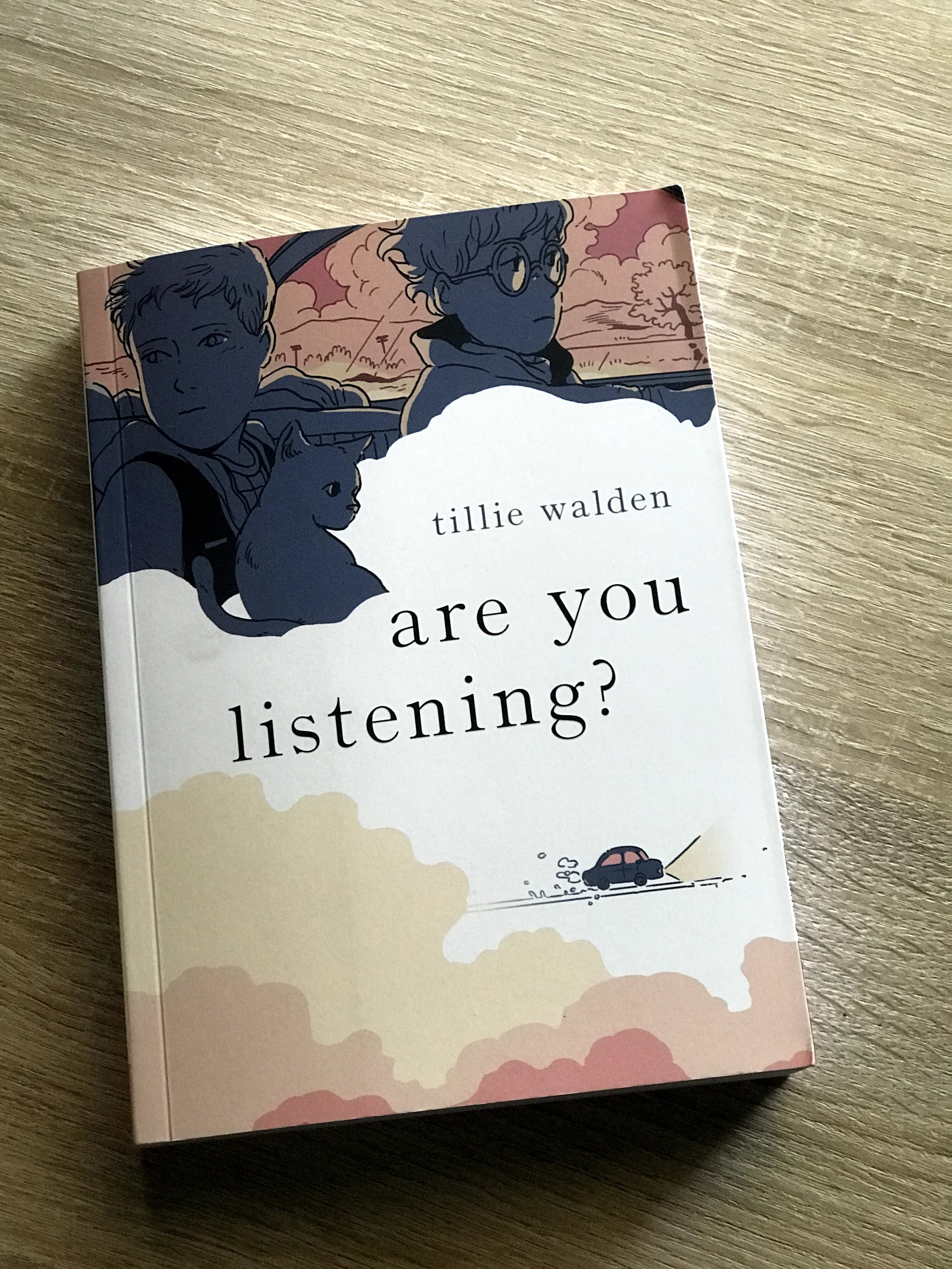  The image shows a comic on a wood surface, the cover of Are You Listening?