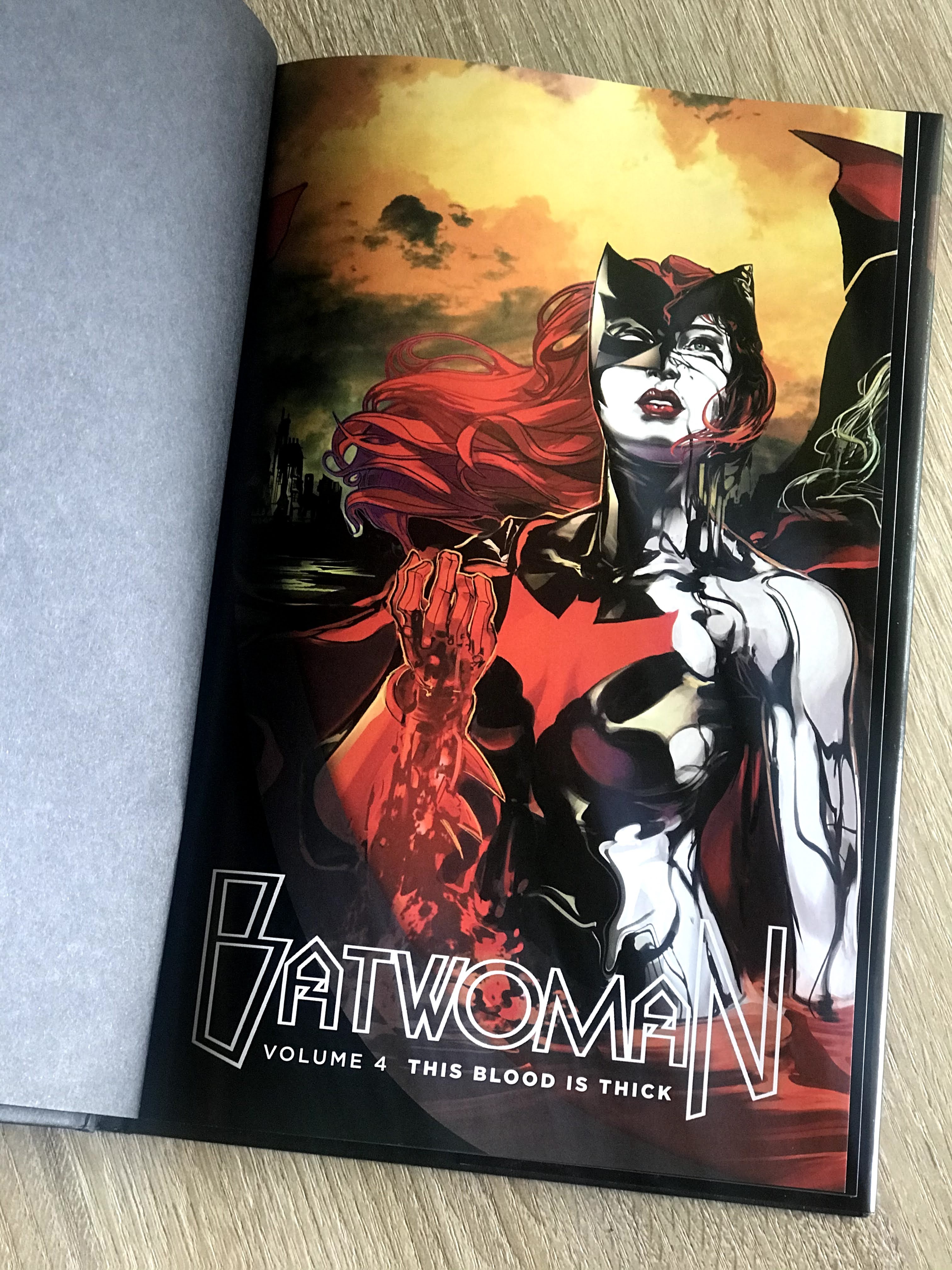 Image of a open hardcover book of Batwoman: Volumn 4 This Blood is Thick
